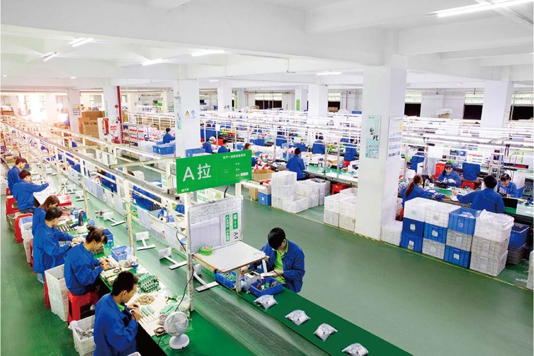 High-angle view of DP factory production floor with workers at LED assembly lines