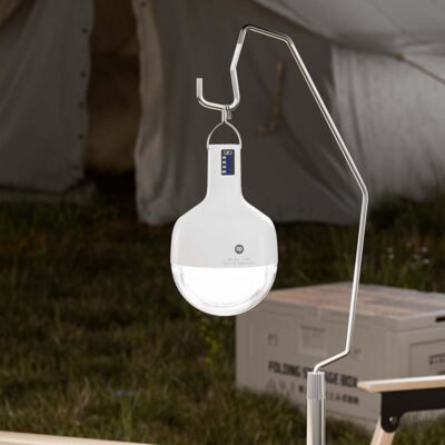 LED camping lantern 7853 with metal hook hanging outdoors for tent lighting.